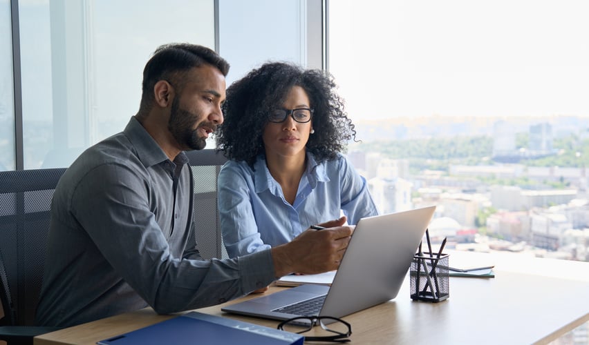 two business owners at a laptop | what are starter 401k plans
